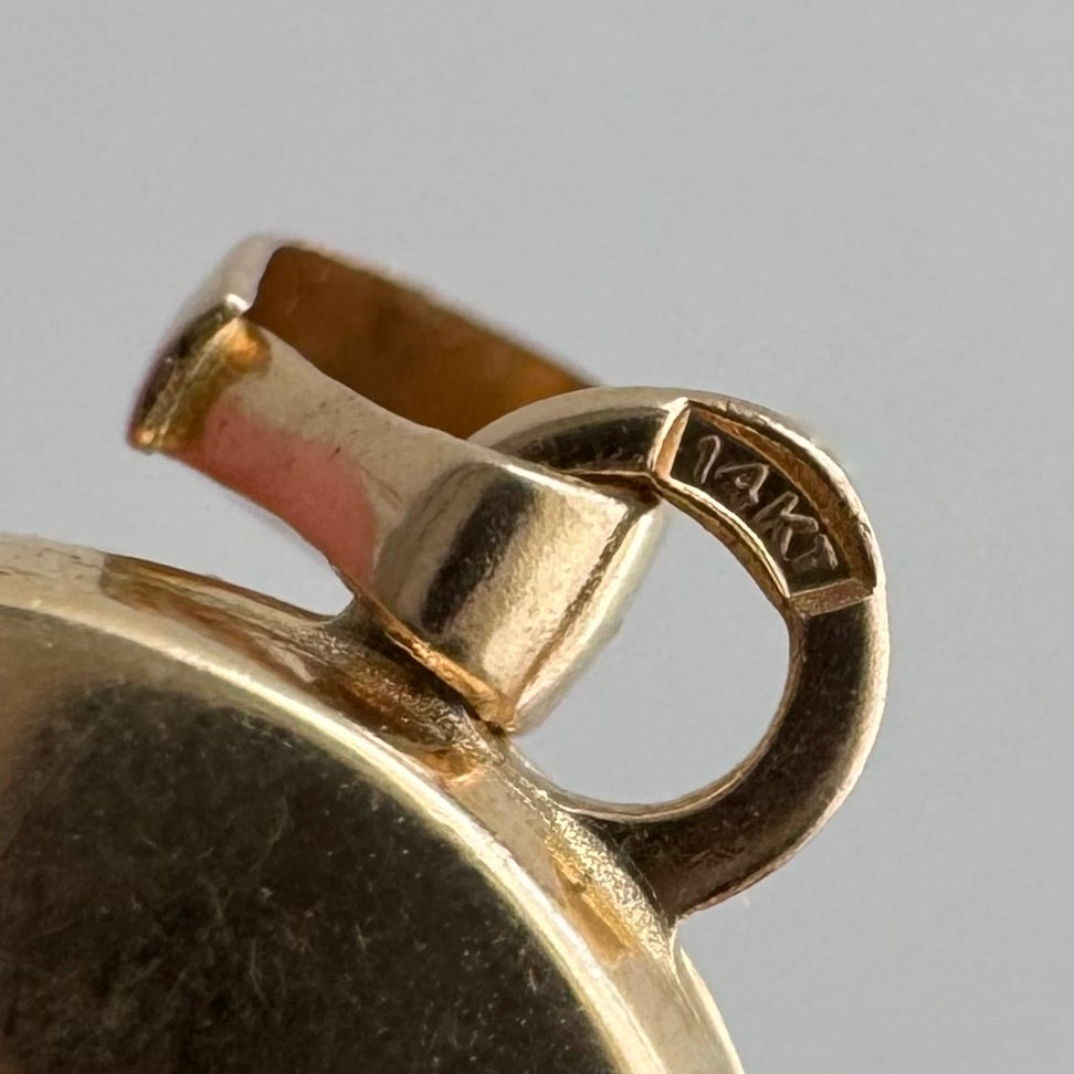 V I N T A G E // lovely memories / 14k oval locket with embossed heart and swirly details / a pendant