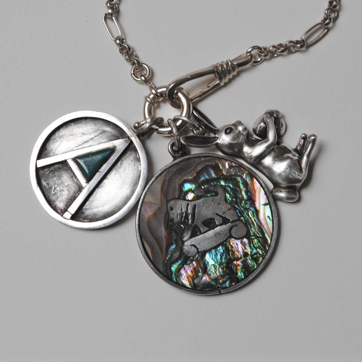 V I N T A G E // psychedelic skateboarding foo dog lion / sterling silver and abalone / a pendant