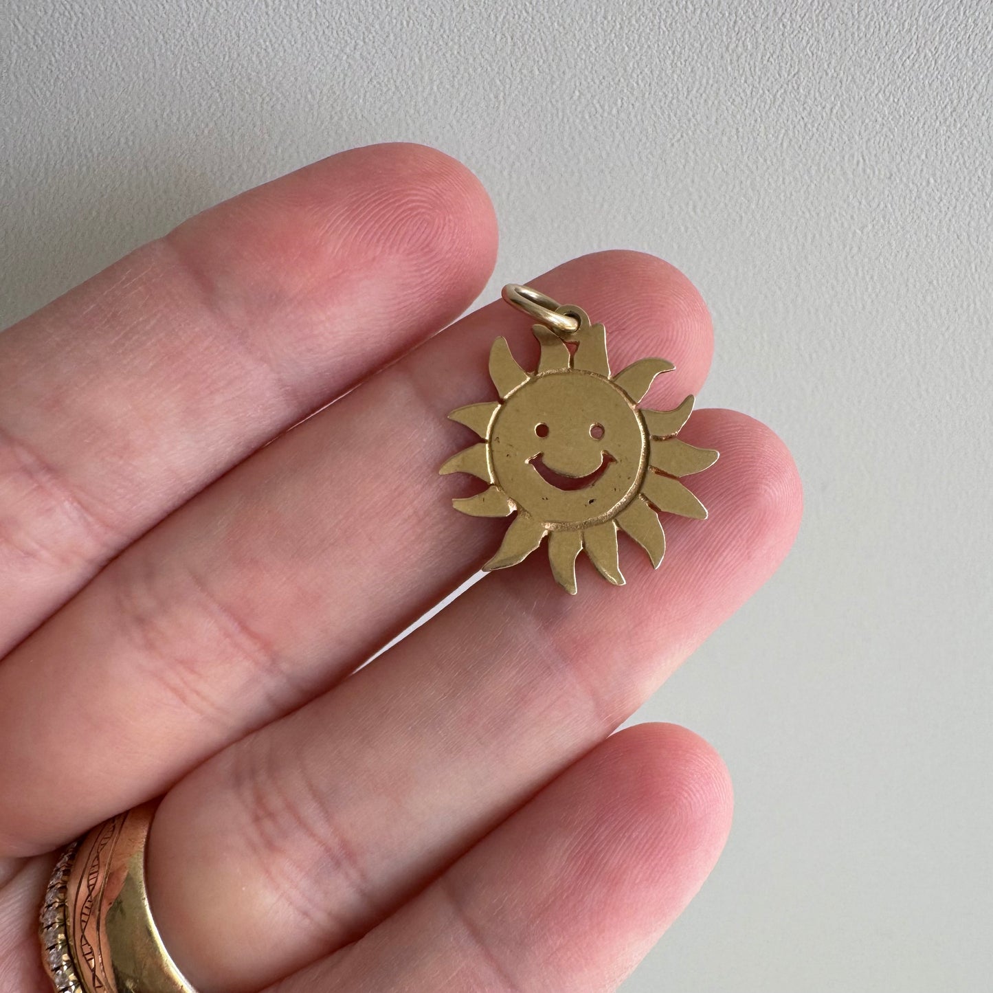 V I N T A G E // cheerful flares / 14k yellow gold sun face / a charm or pendant