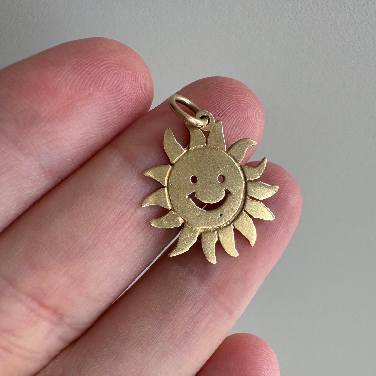 V I N T A G E // cheerful flares / 14k yellow gold sun face / a charm or pendant