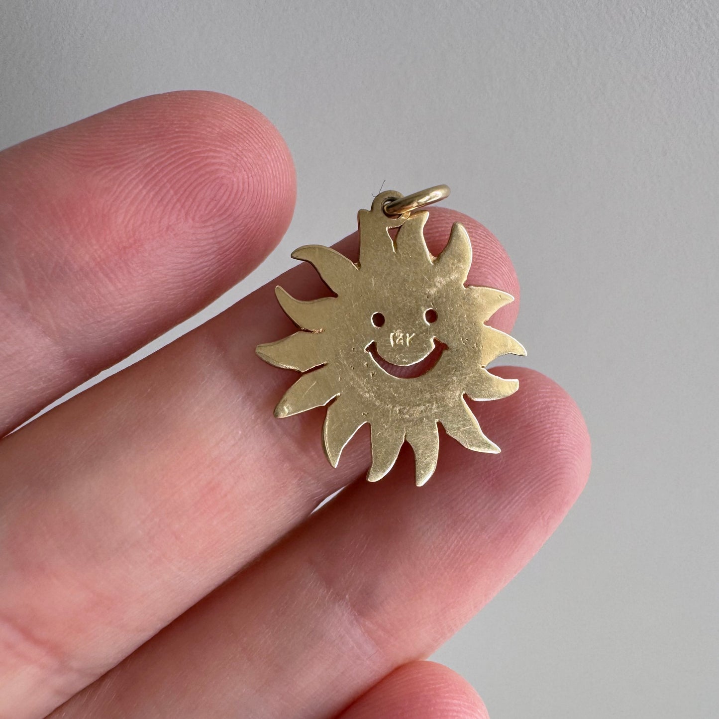 V I N T A G E // cheerful flares / 14k yellow gold sun face / a charm or pendant