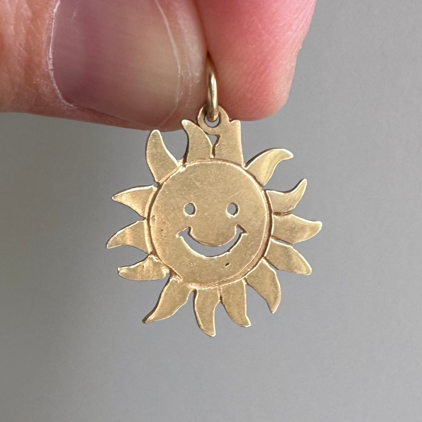 V I N T A G E // cheerful flares / 14k yellow gold sun face / a charm or pendant