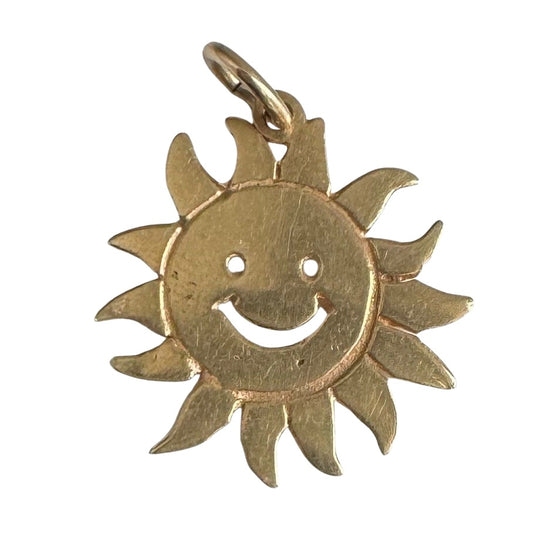 V I N T A G E // cheerful flares / 14k yellow gold sun face / a charm or pendant