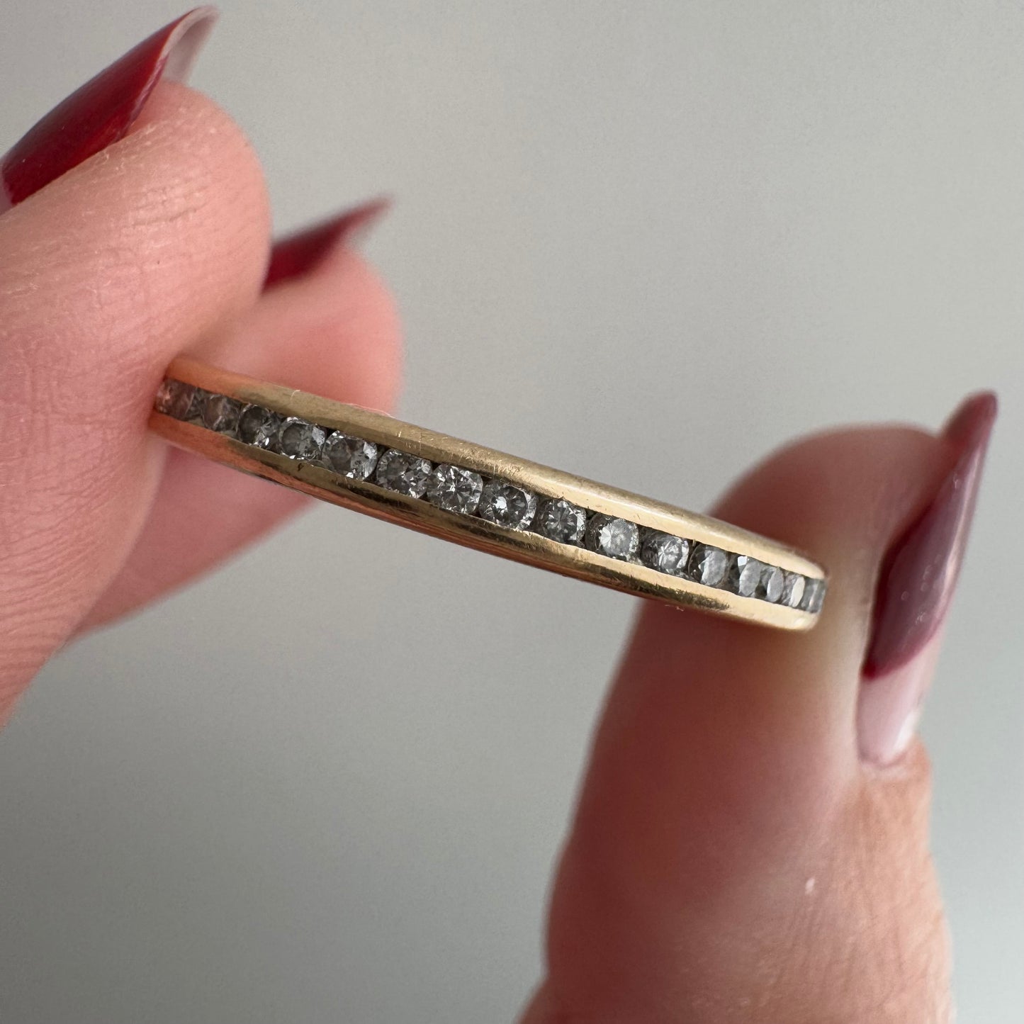 V I N T A G E // sparkly horizon / 14k yellow gold and channel set diamond half eternity band / size 10.75