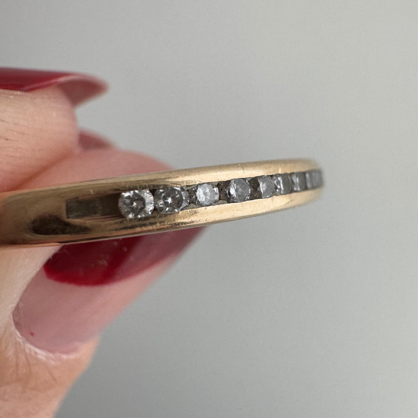 V I N T A G E // sparkly horizon / 14k yellow gold and channel set diamond half eternity band / size 10.75