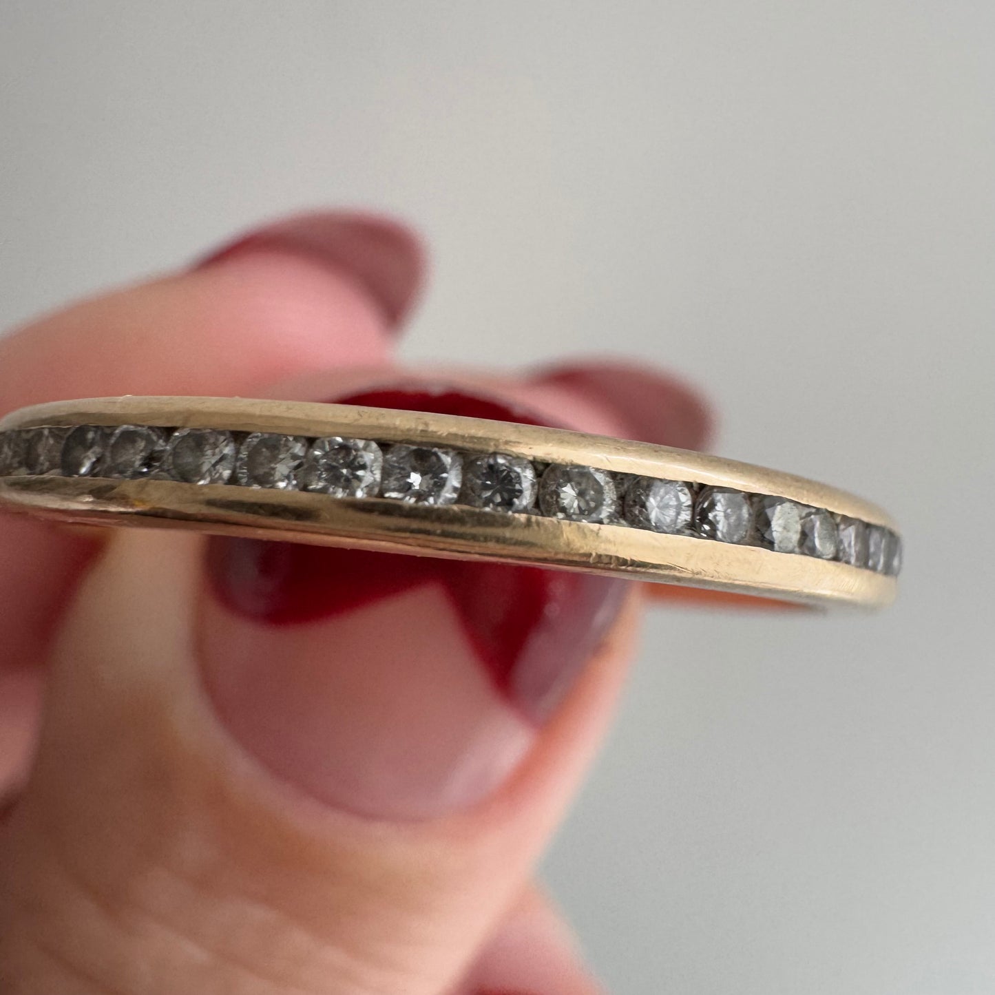 V I N T A G E // sparkly horizon / 14k yellow gold and channel set diamond half eternity band / size 10.75