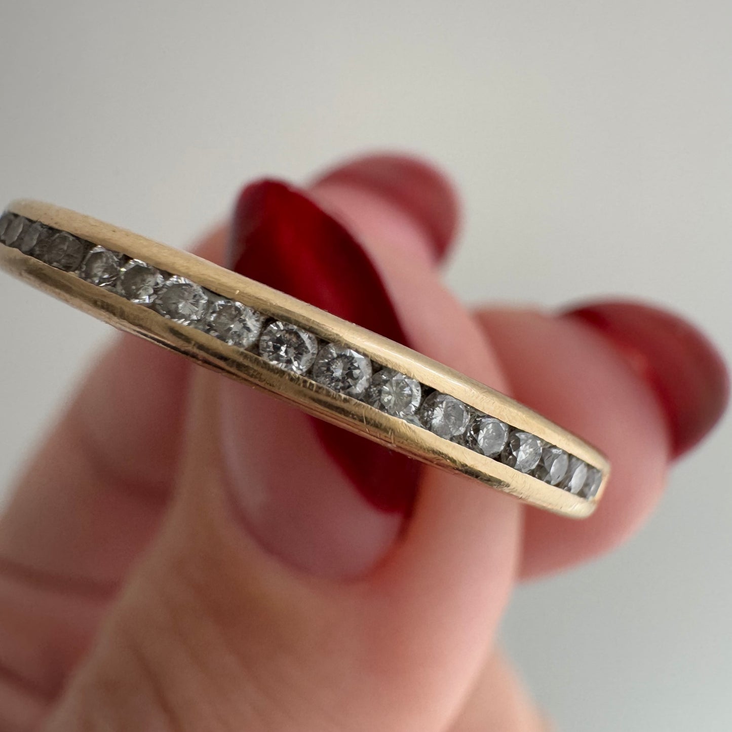 V I N T A G E // sparkly horizon / 14k yellow gold and channel set diamond half eternity band / size 10.75