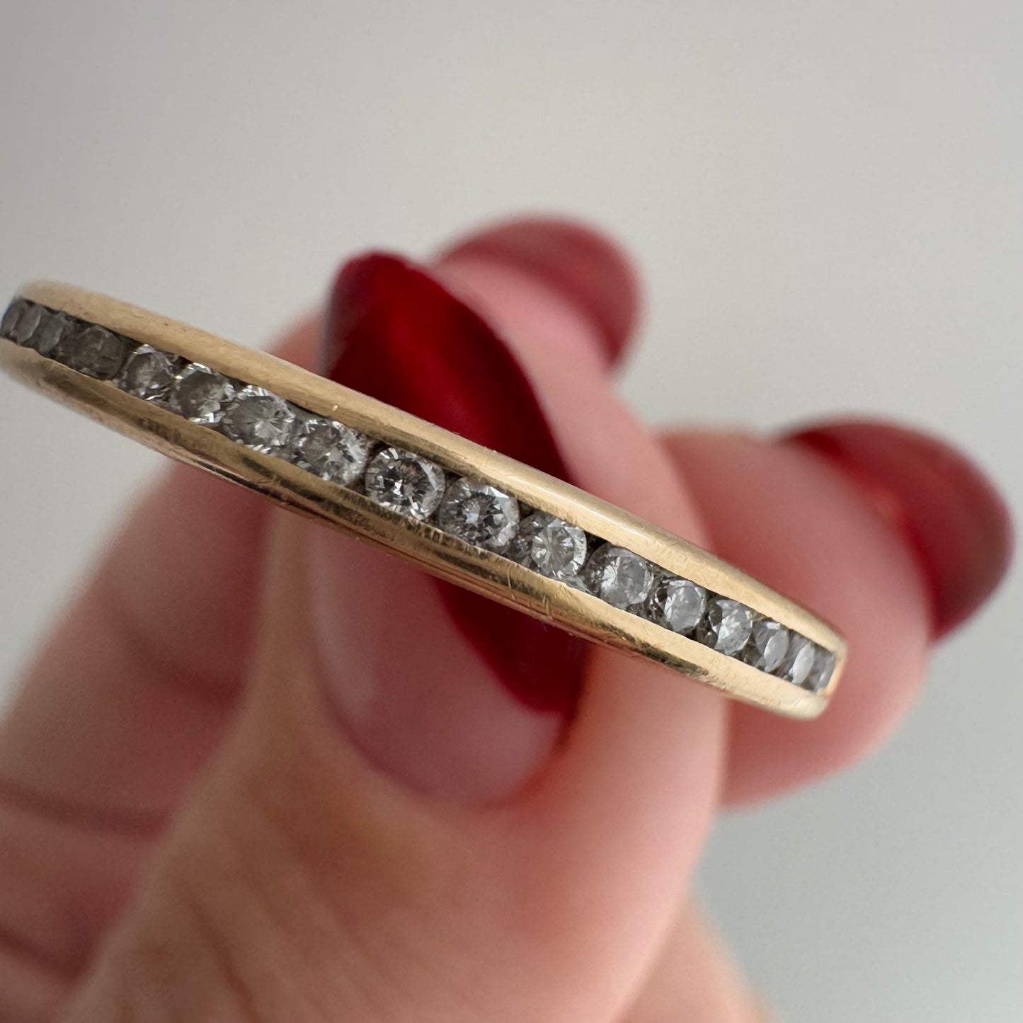 V I N T A G E // sparkly horizon / 14k yellow gold and channel set diamond half eternity band / size 10.75