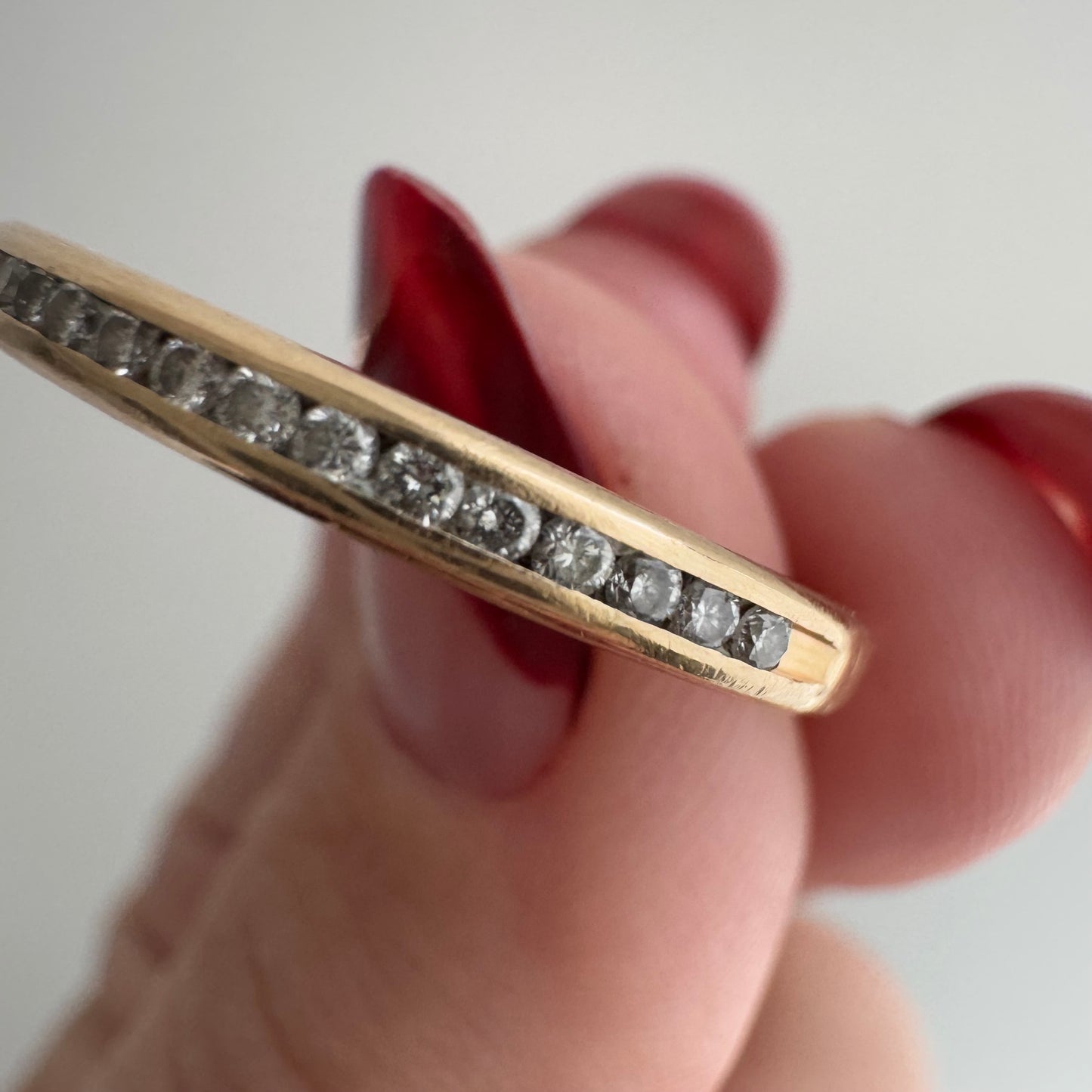 V I N T A G E // sparkly horizon / 14k yellow gold and channel set diamond half eternity band / size 10.75