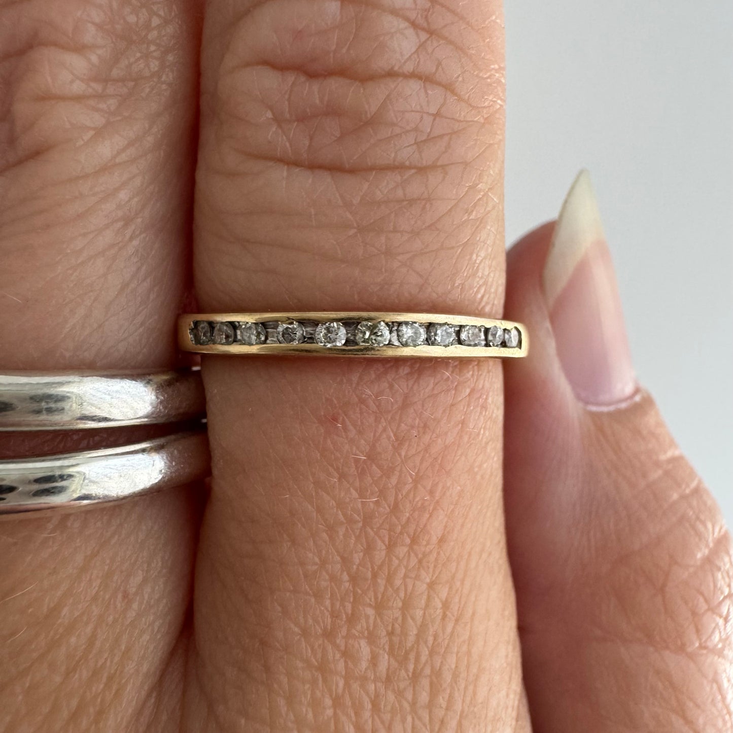 V I N T A G E // eleven sparkles / 14k yellow gold and 11 channel set diamonds / half eternity band / size 7.5
