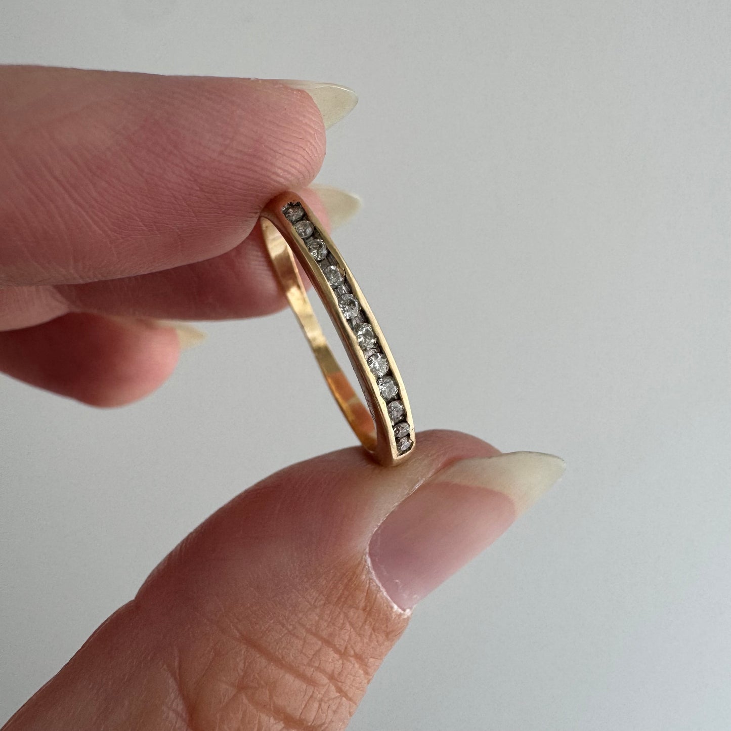 V I N T A G E // eleven sparkles / 14k yellow gold and 11 channel set diamonds / half eternity band / size 7.5
