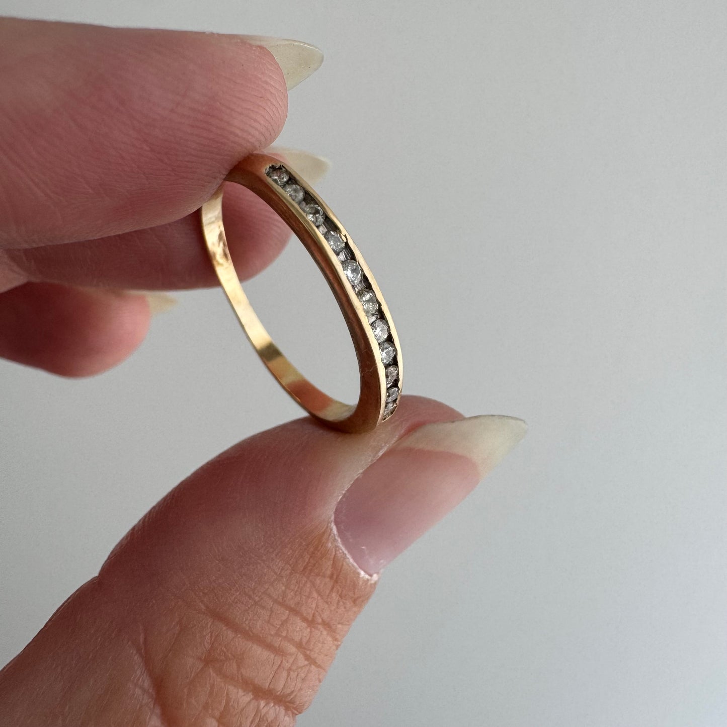 V I N T A G E // eleven sparkles / 14k yellow gold and 11 channel set diamonds / half eternity band / size 7.5