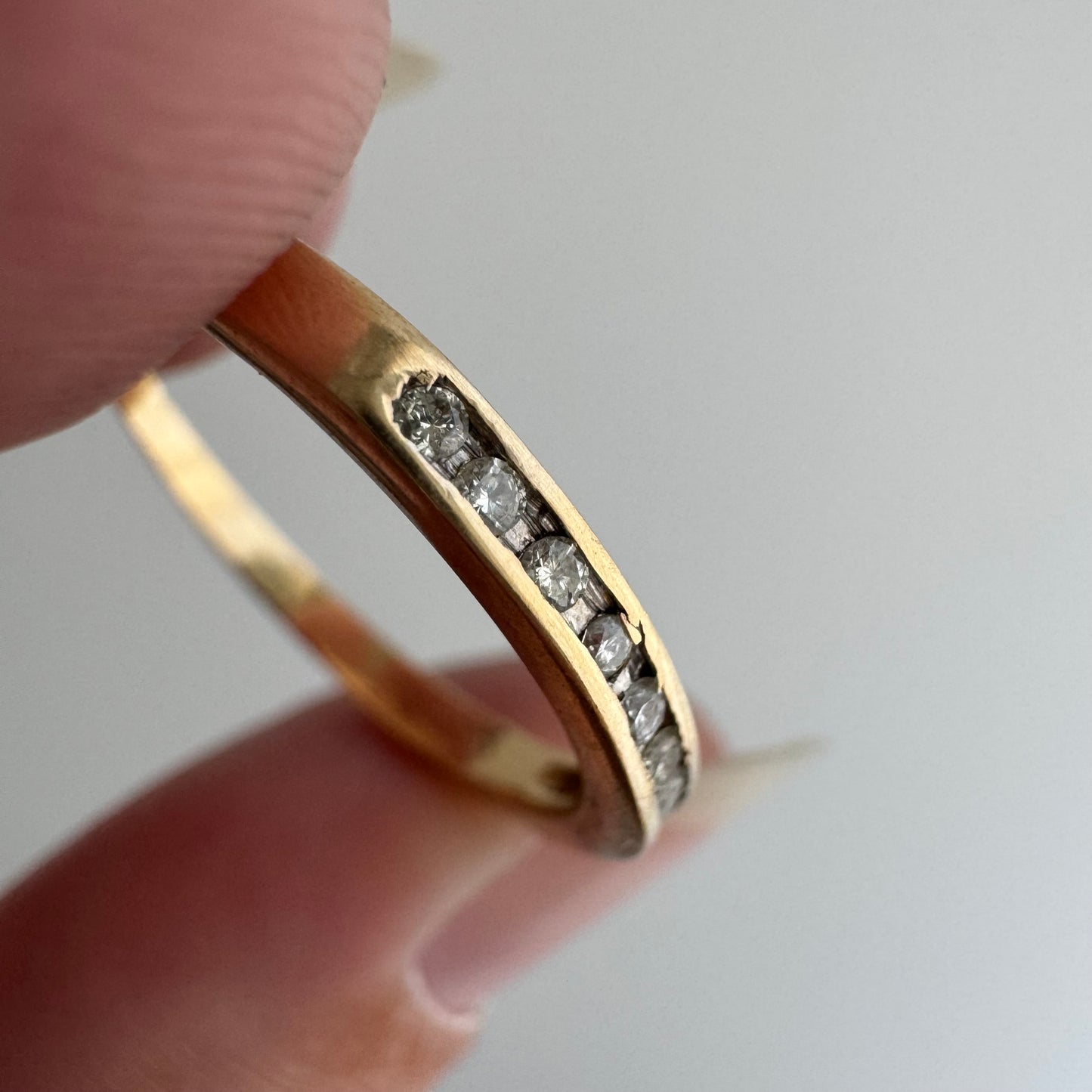 V I N T A G E // eleven sparkles / 14k yellow gold and 11 channel set diamonds / half eternity band / size 7.5