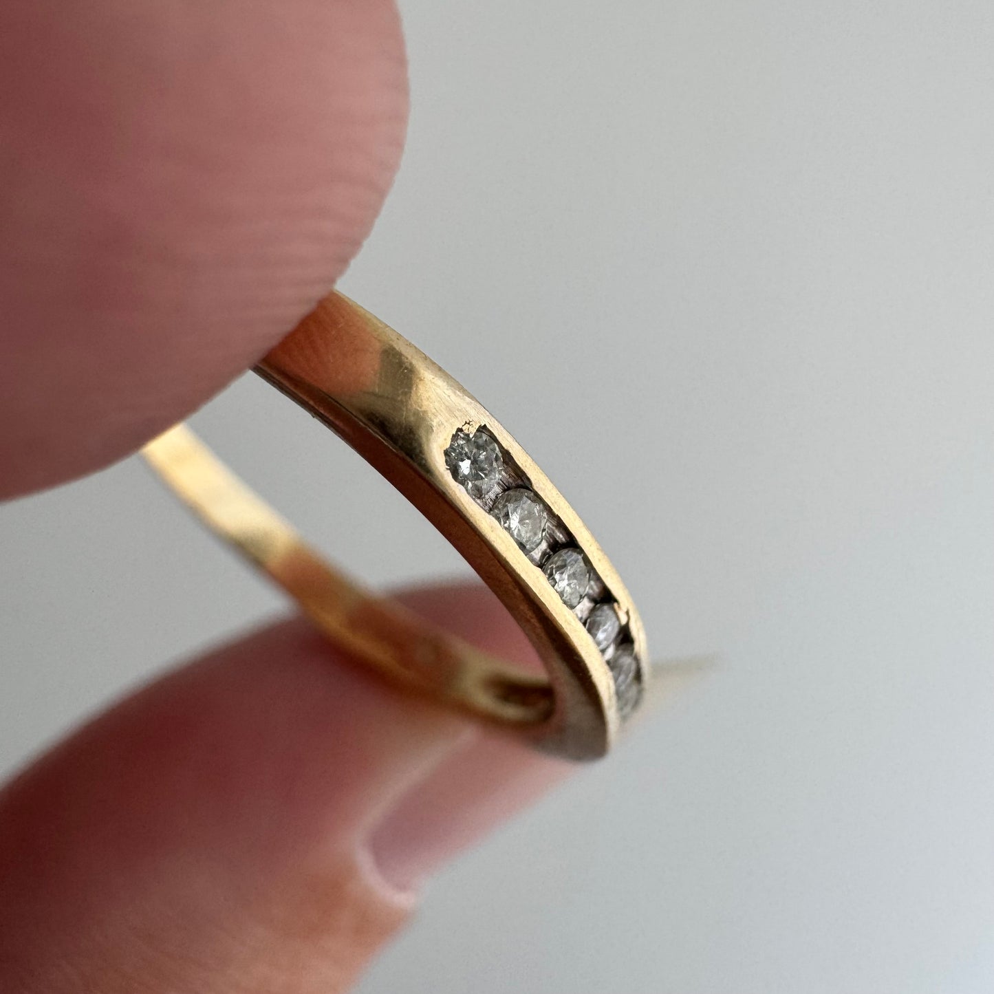 V I N T A G E // eleven sparkles / 14k yellow gold and 11 channel set diamonds / half eternity band / size 7.5