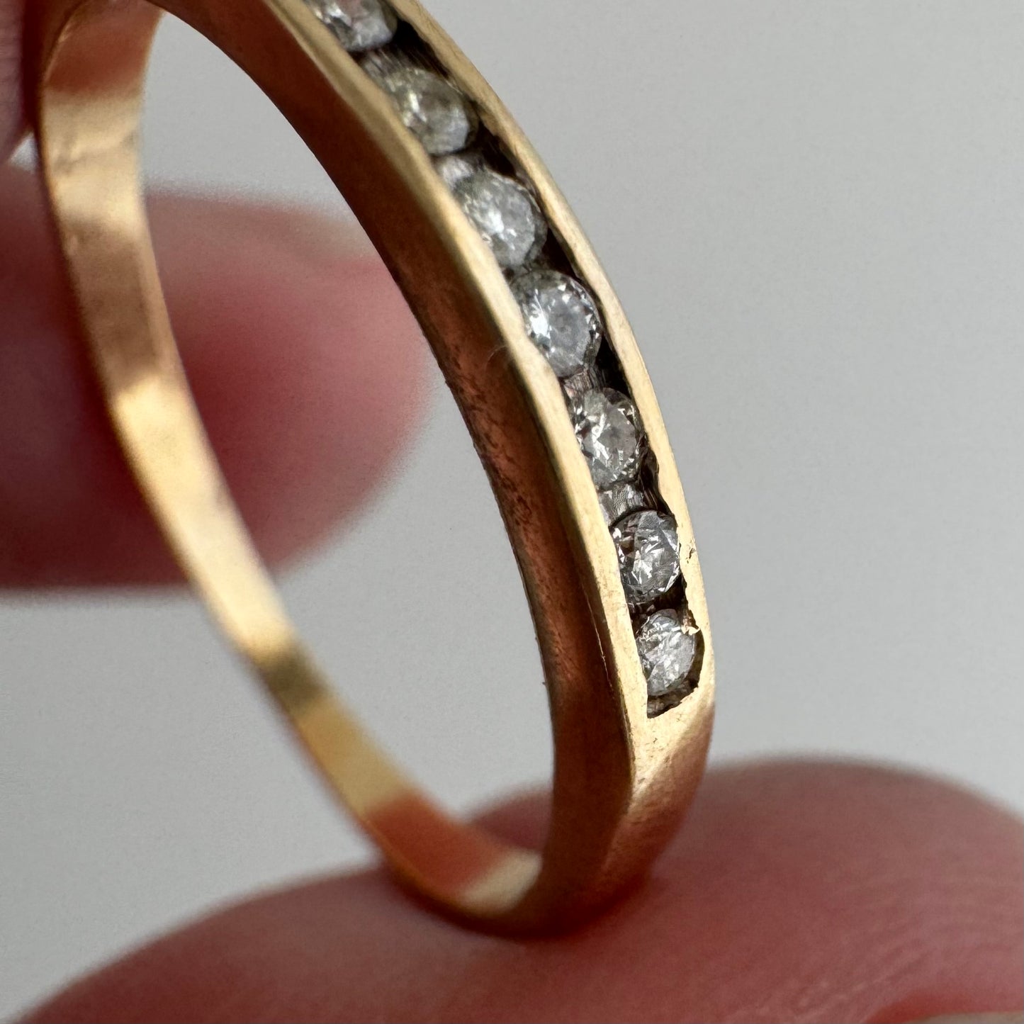 V I N T A G E // eleven sparkles / 14k yellow gold and 11 channel set diamonds / half eternity band / size 7.5
