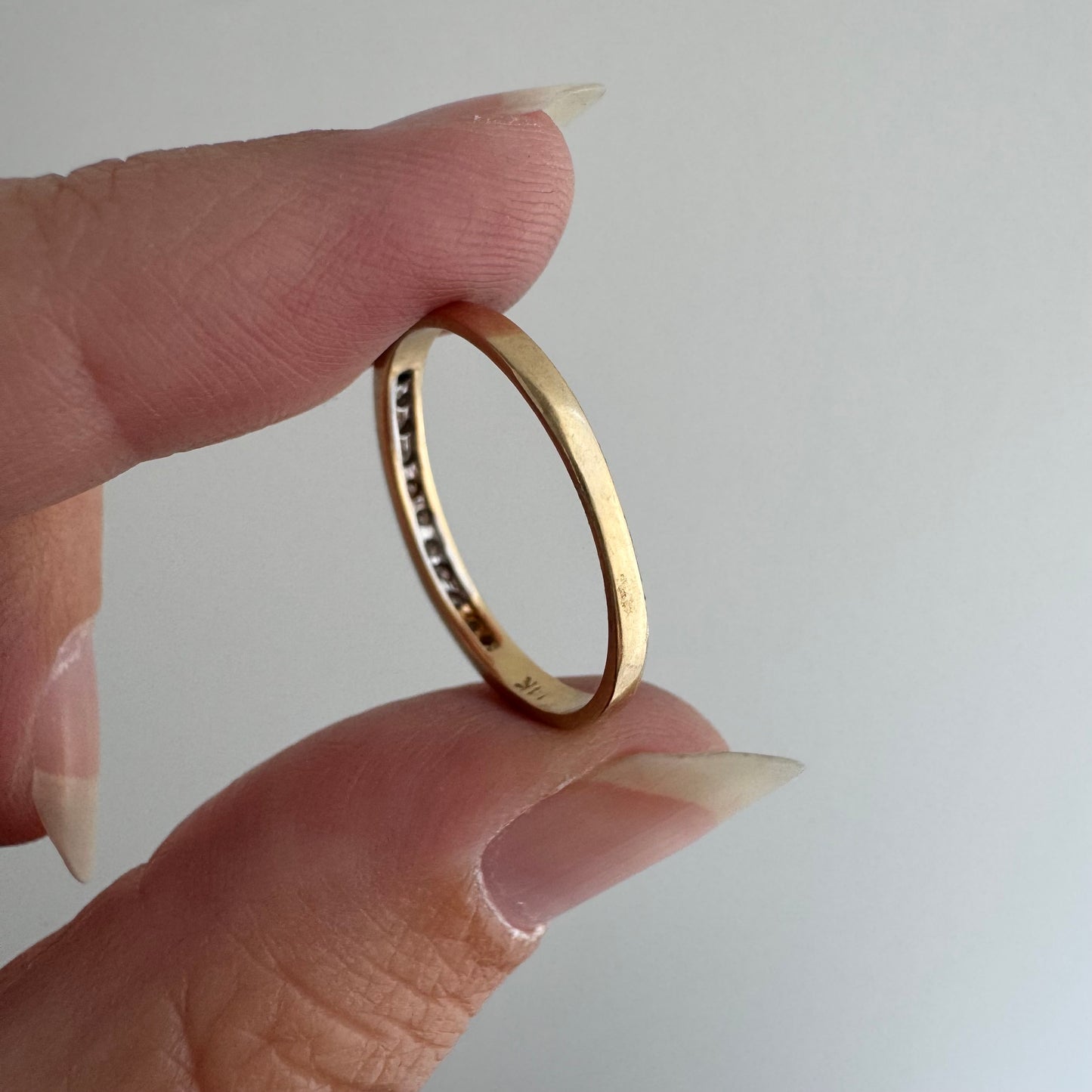 V I N T A G E // eleven sparkles / 14k yellow gold and 11 channel set diamonds / half eternity band / size 7.5