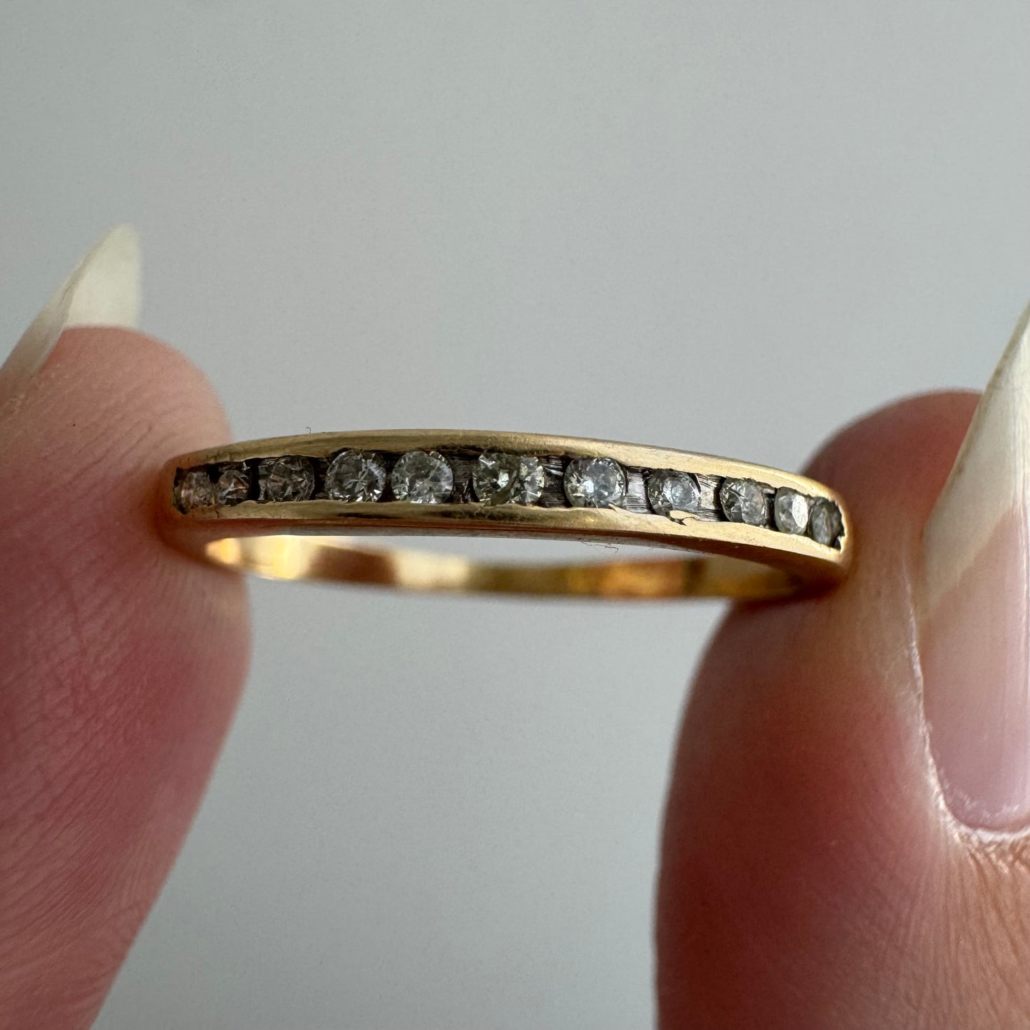 V I N T A G E // eleven sparkles / 14k yellow gold and 11 channel set diamonds / half eternity band / size 7.5