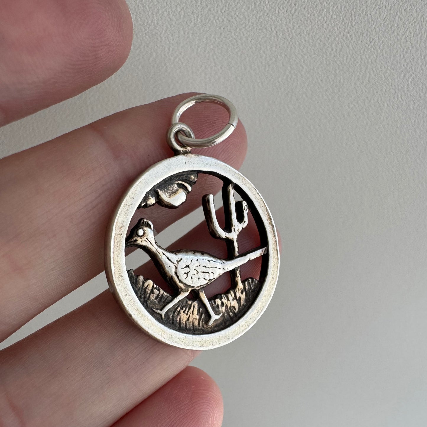 V I N T A G E // slowing down / sterling silver strutting road runner scene / a pendant