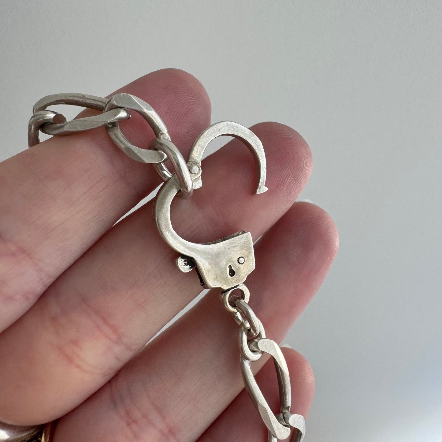 reimagined V I N T A G E // handcuff clasp / re-worked sterling silver figaro chain / 22.25", 33.7g
