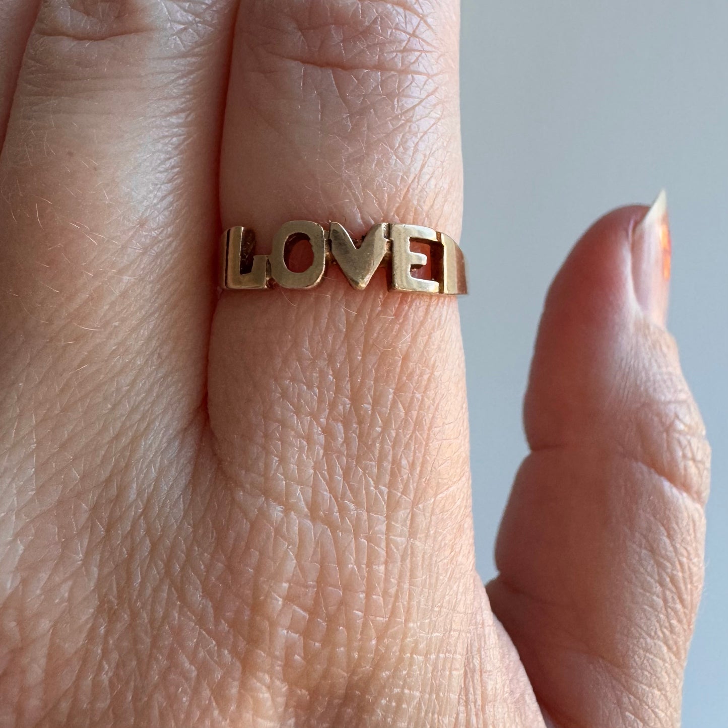 V I N T A G E // bold LOVE / 9k yellow gold LOVE word ring / size 6.25