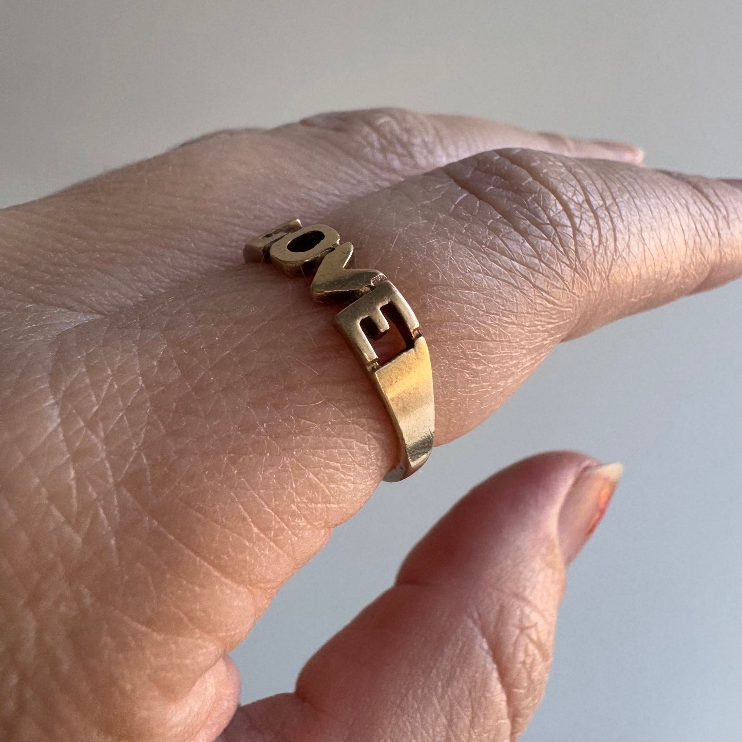 V I N T A G E // bold LOVE / 9k yellow gold LOVE word ring / size 6.25