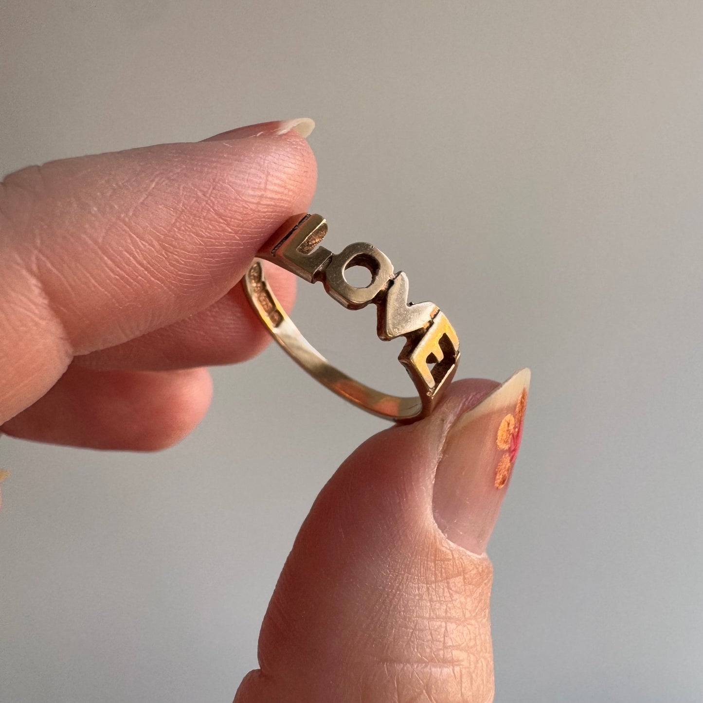 V I N T A G E // bold LOVE / 9k yellow gold LOVE word ring / size 6.25