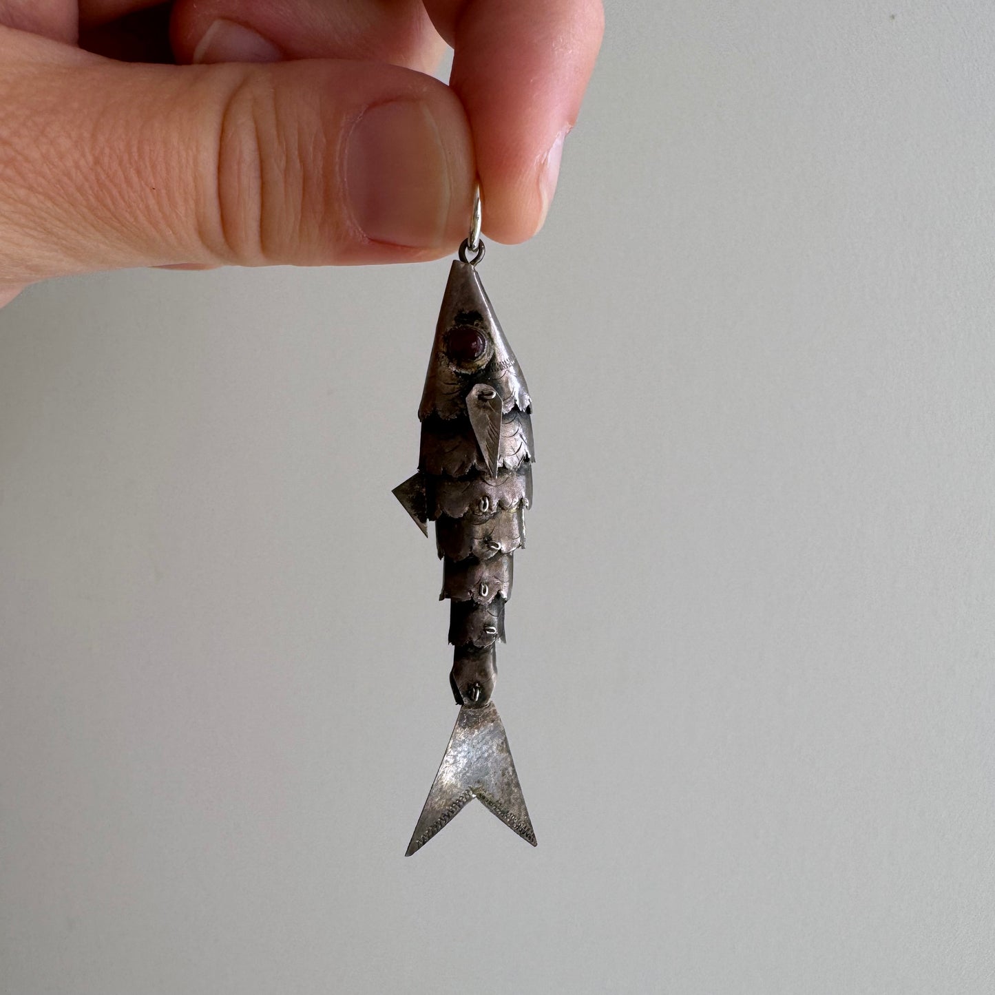 V I N T A G E // lucky catch / sterling silver articulated wiggle fish with burgundy eyes / a pendant