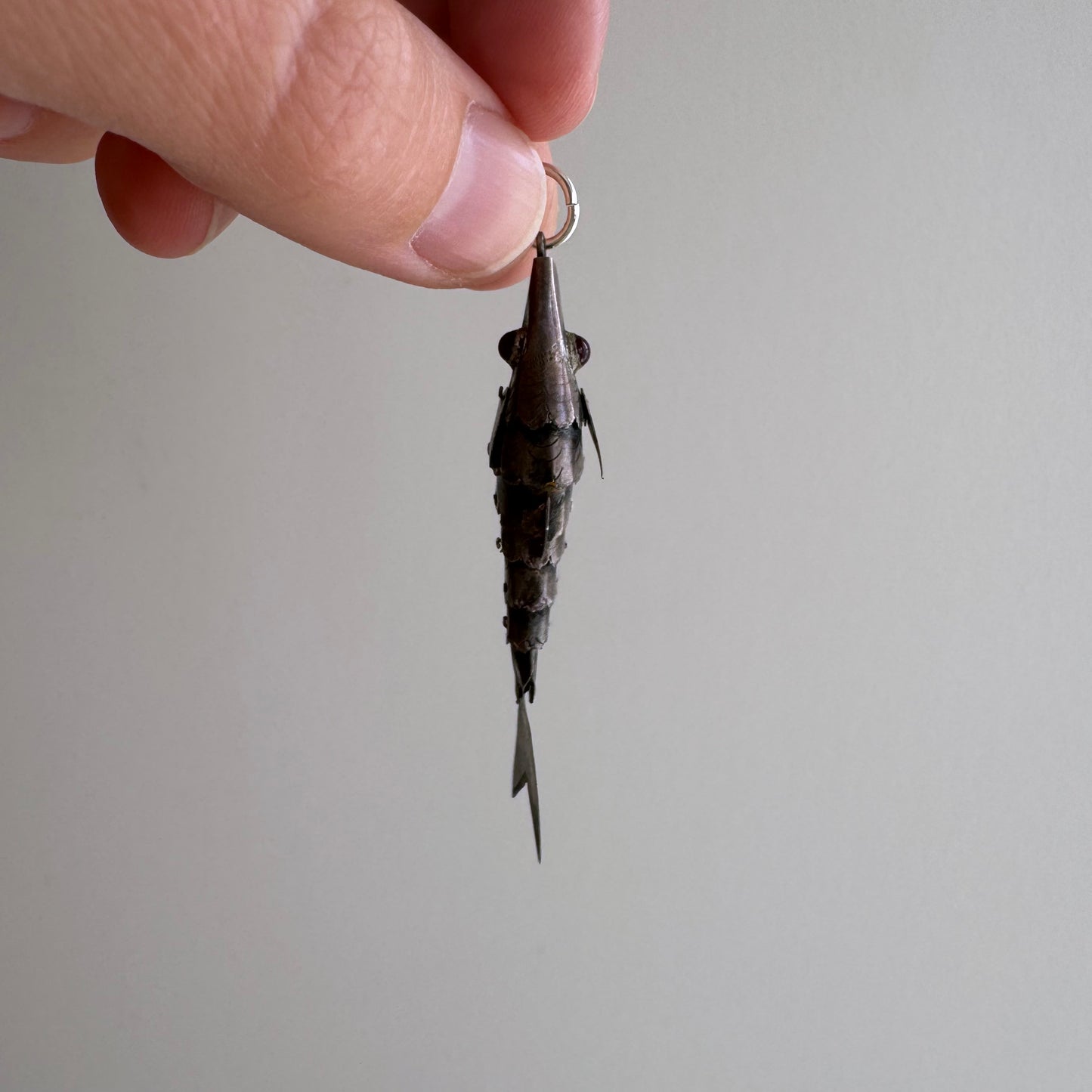 V I N T A G E // lucky catch / sterling silver articulated wiggle fish with burgundy eyes / a pendant