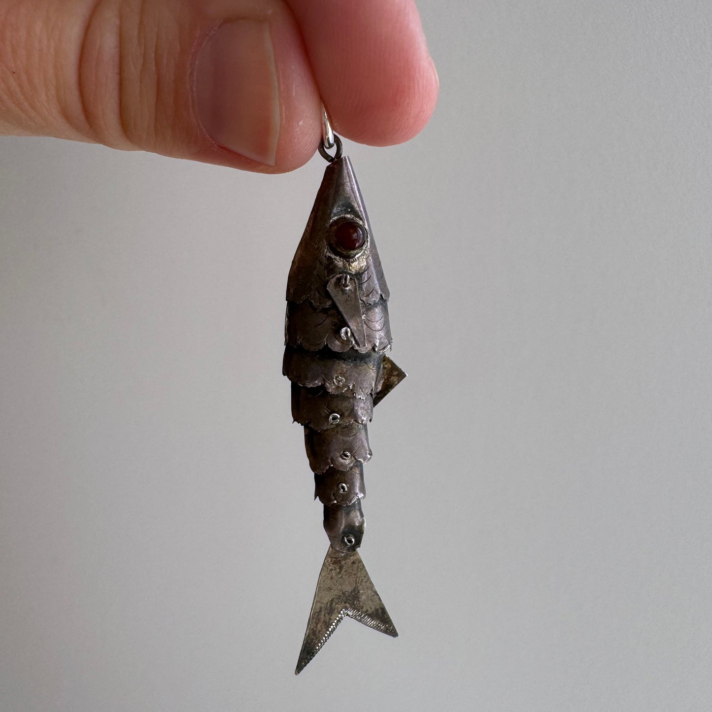 V I N T A G E // lucky catch / sterling silver articulated wiggle fish with burgundy eyes / a pendant