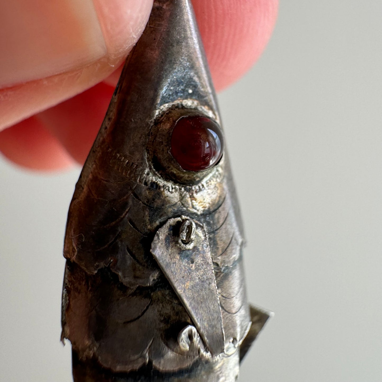 V I N T A G E // lucky catch / sterling silver articulated wiggle fish with burgundy eyes / a pendant