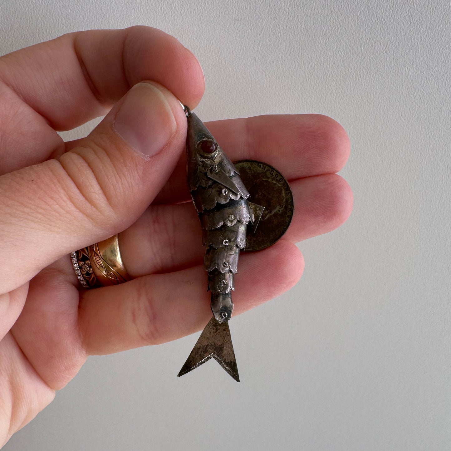 V I N T A G E // lucky catch / sterling silver articulated wiggle fish with burgundy eyes / a pendant