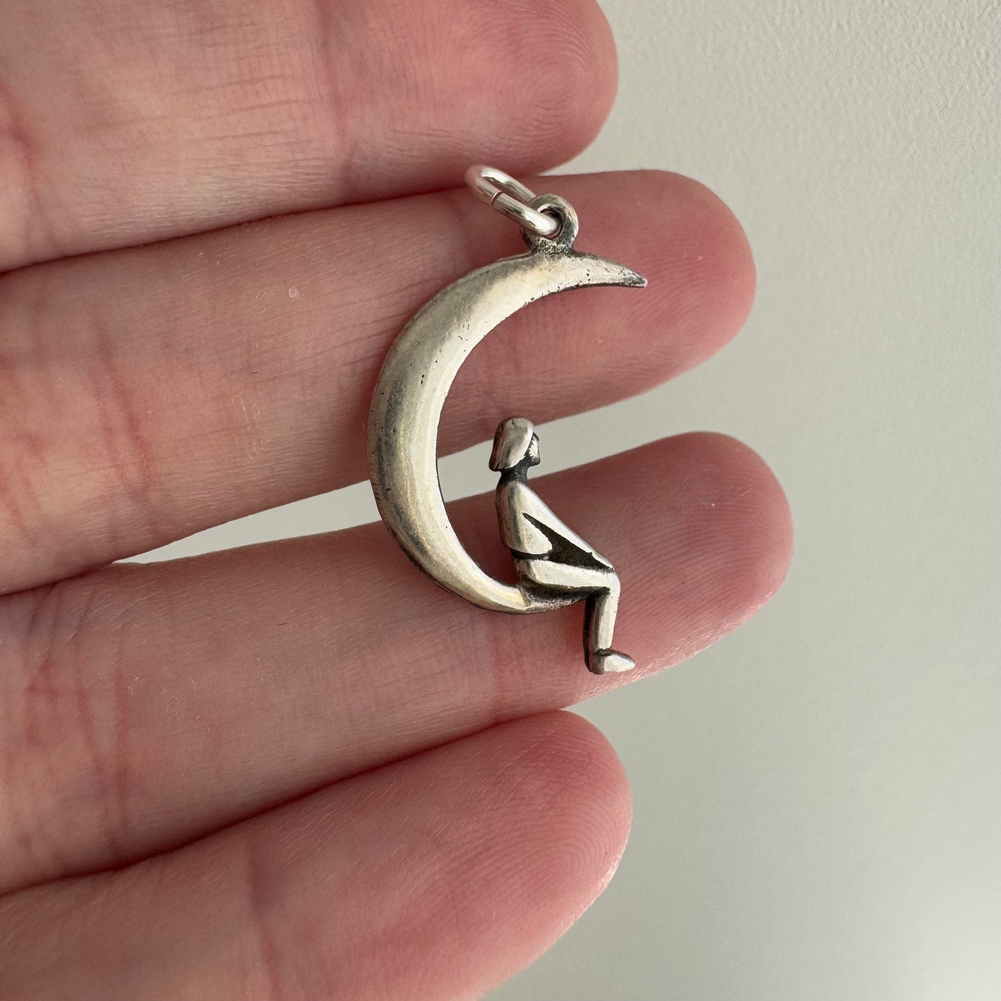 P R E - L O V E D // lunar perspective / sterling silver person sitting on a crescent moon / a pendant