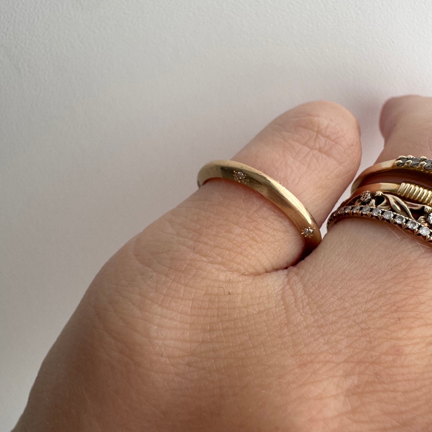 reimagined A N T I Q U E // 14k yellow gold knife edge JR Wood band with new starburst diamond / size 4.75