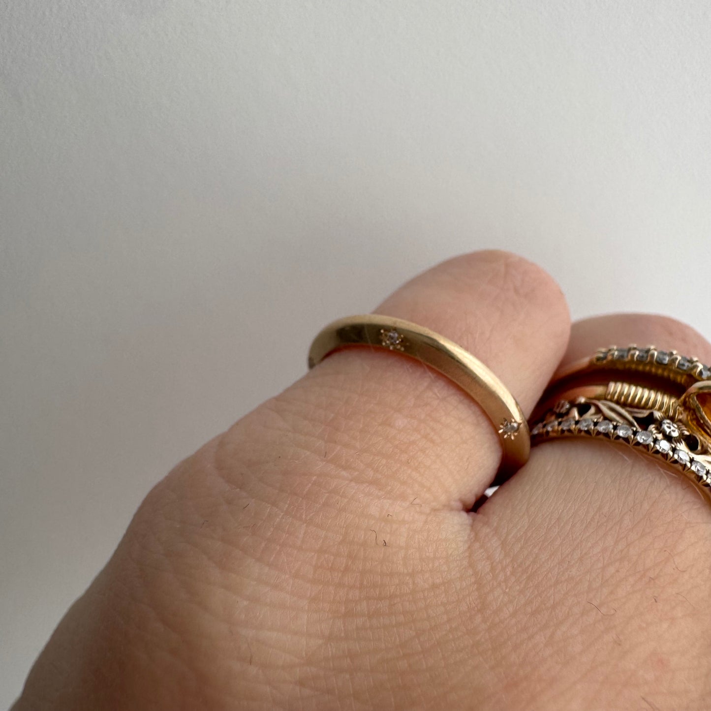 reimagined A N T I Q U E // 14k yellow gold knife edge JR Wood band with new starburst diamond / size 4.75