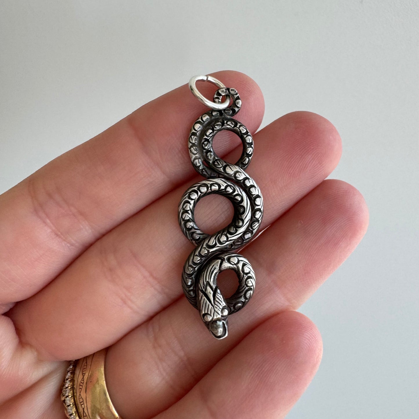V I N T A G E // looping snake / sterling silver stamped and engraved snake / a pendant