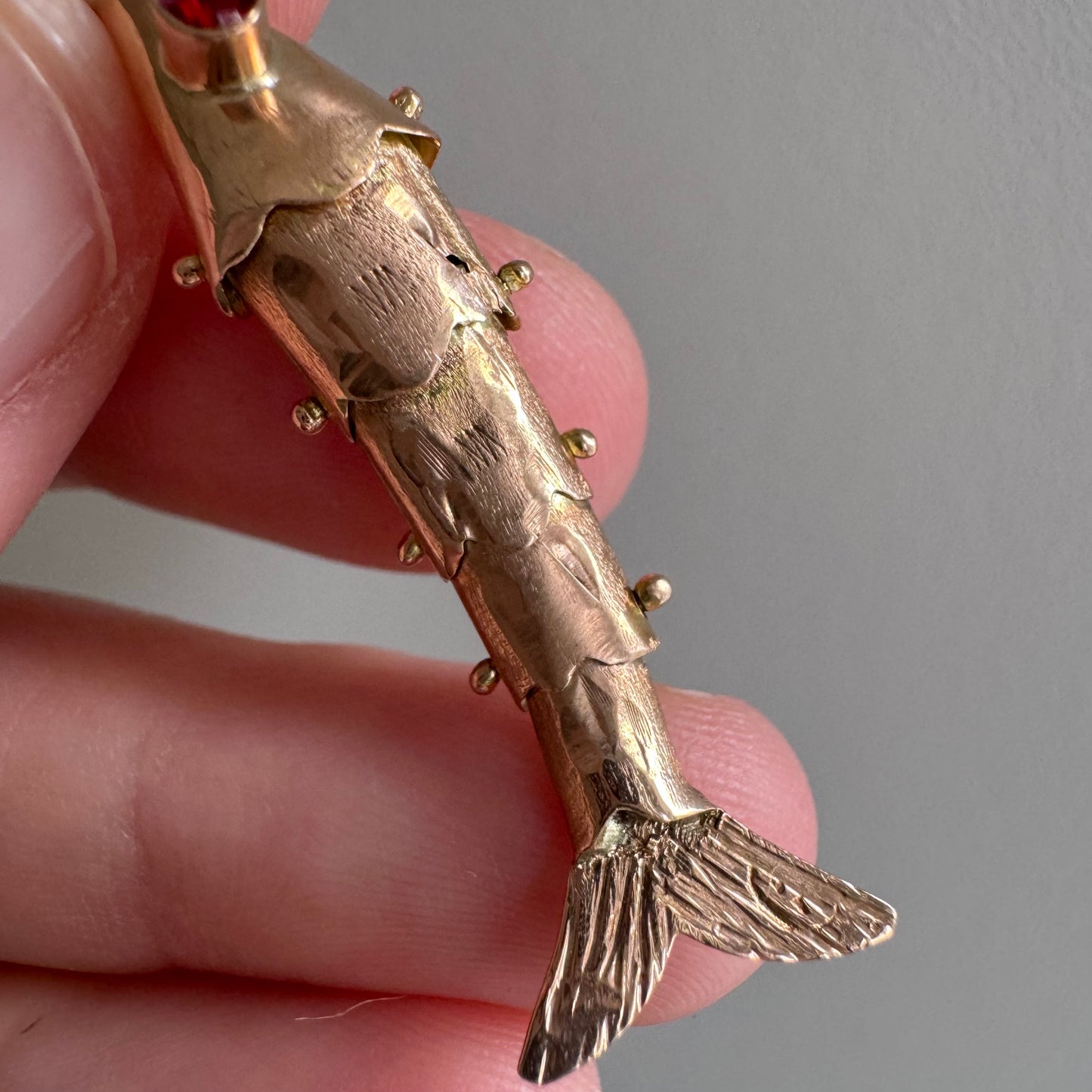 V I N T A G E // wiggly catch / 14k rosy yellow gold and red glass articulated wiggle fish / a pendant