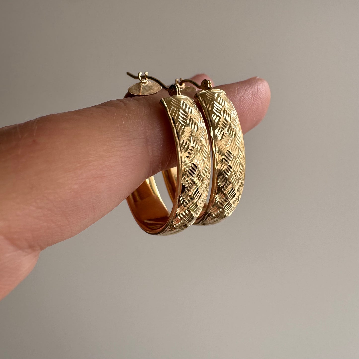 P R E - L O V E D // terrific texture / 14k yellow gold wide oval hoops / over 1"