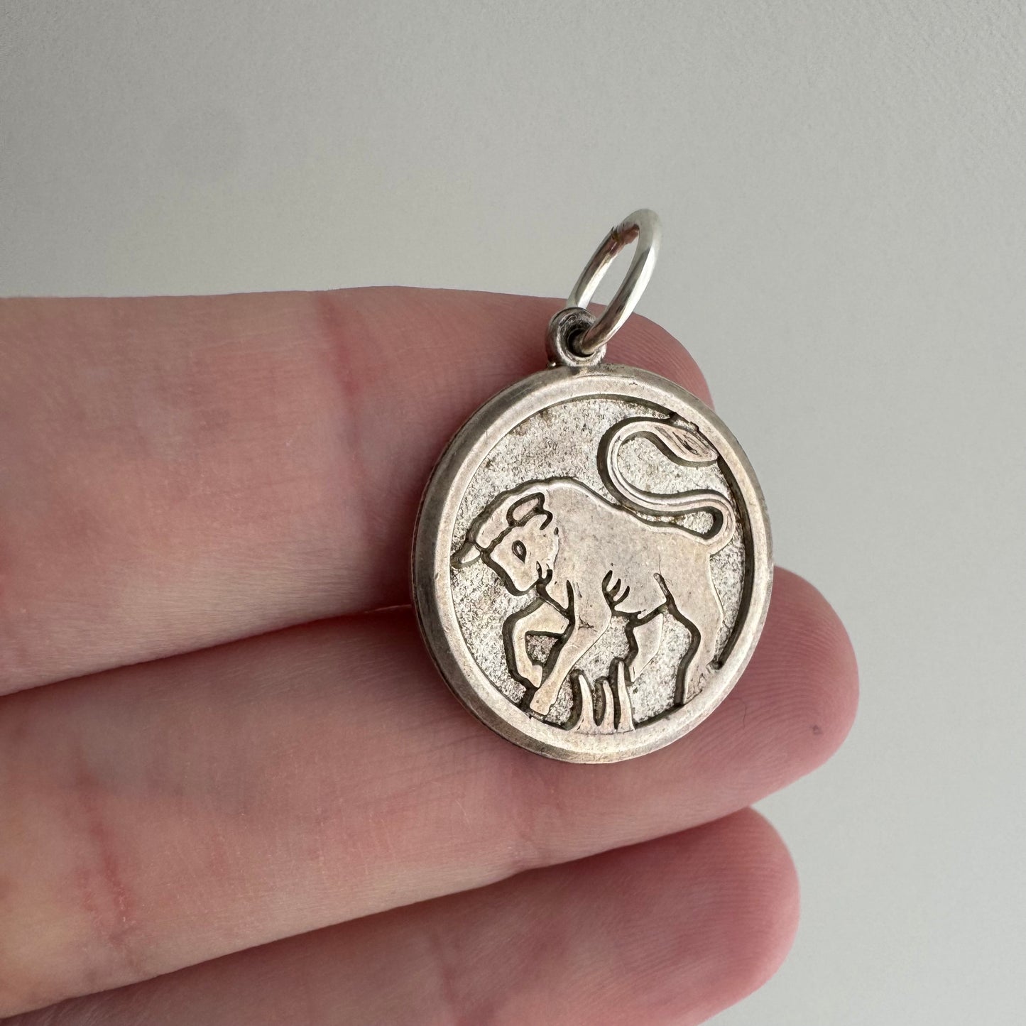 V I N T A G E // bullish / sterling silver framed bull in relief / a pendant