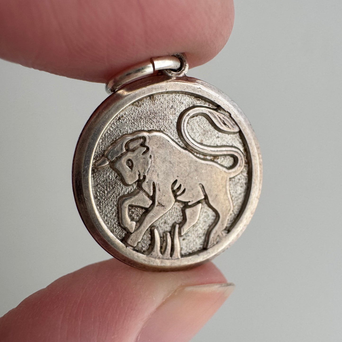 V I N T A G E // bullish / sterling silver framed bull in relief / a pendant