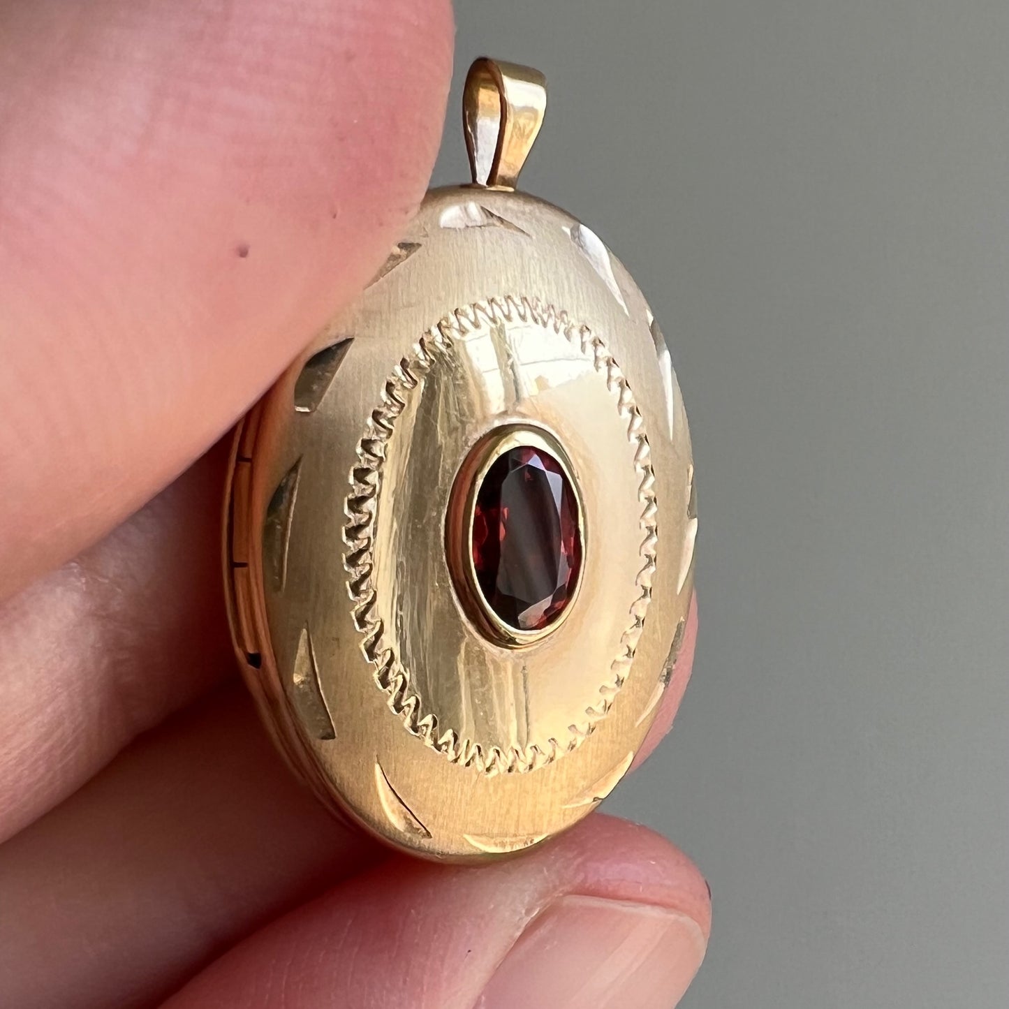 V I N T A G E // faceted memories / 14k and garnet oval locket with engraved details / a pendant