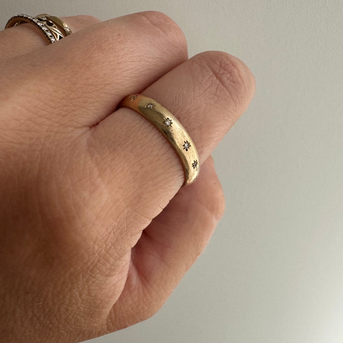 reimagined V I N T A G E // star story / 10k 4mm subtle D-shaped band with seven new star-set diamonds / size 9.5-9.75