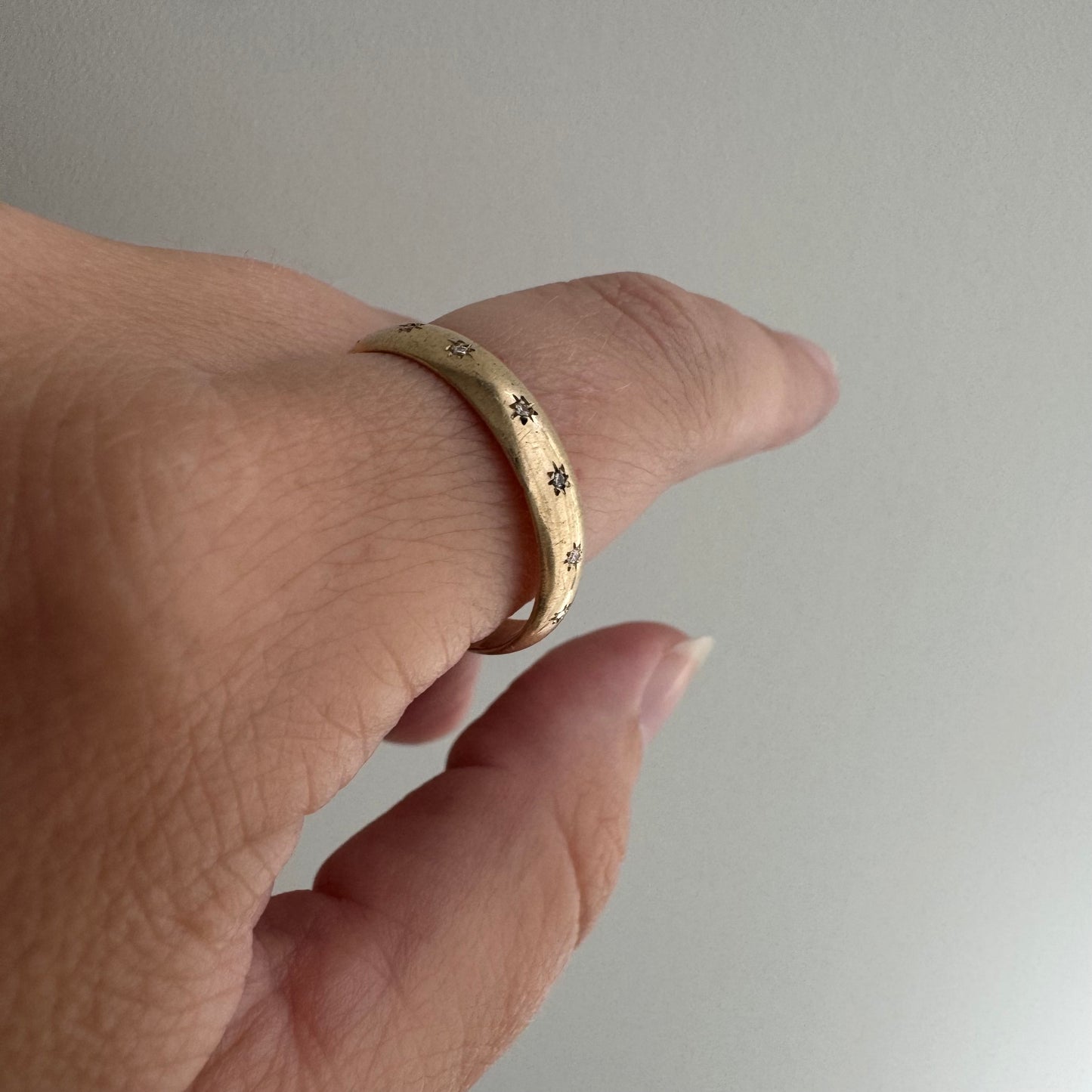 reimagined V I N T A G E // star story / 10k 4mm subtle D-shaped band with seven new star-set diamonds / size 9.5-9.75
