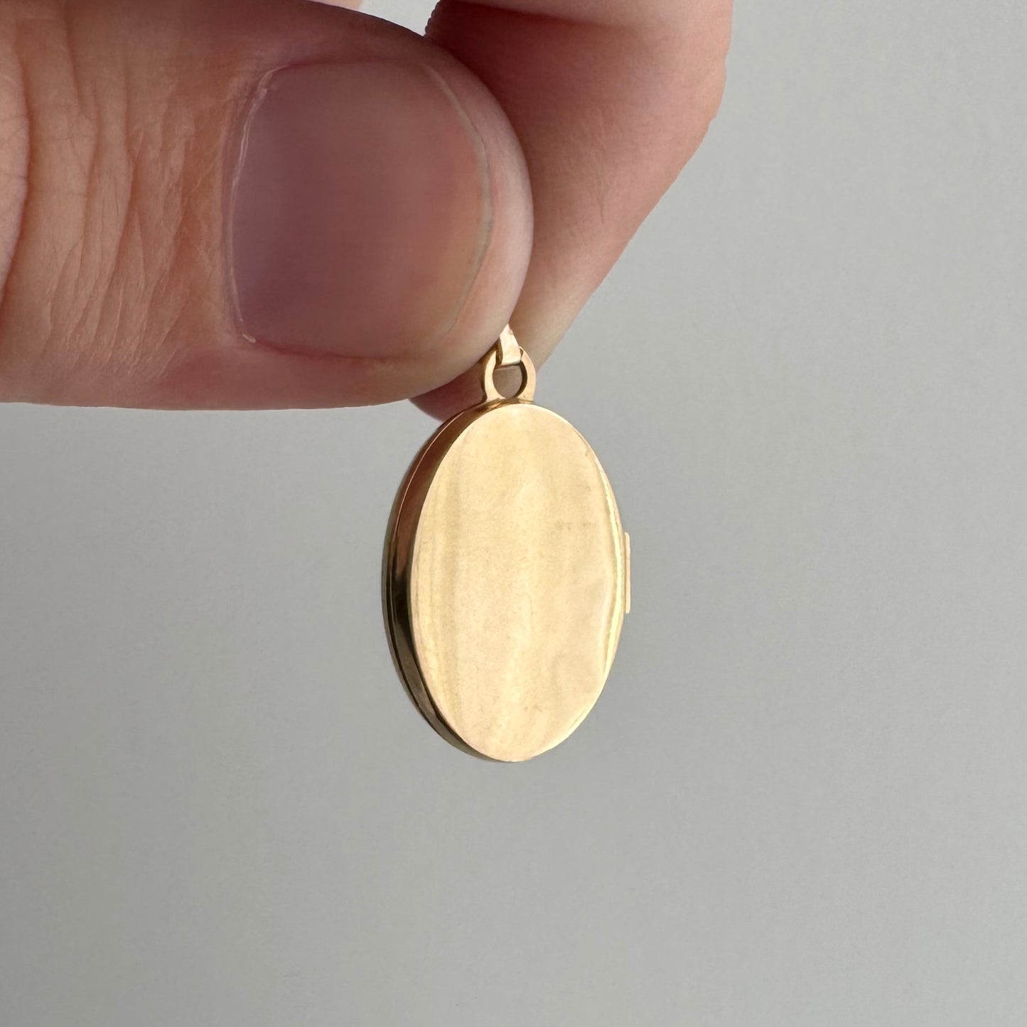 V I N T A G E // lovely memories / 14k oval locket with embossed heart and swirly details / a pendant