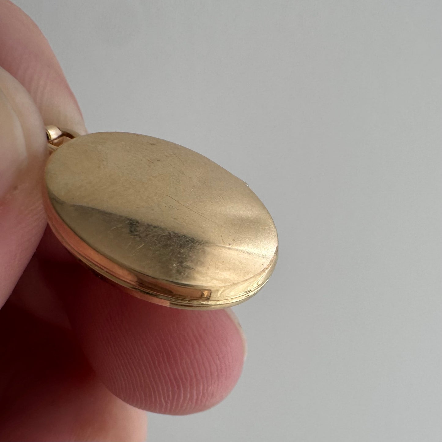 V I N T A G E // lovely memories / 14k oval locket with embossed heart and swirly details / a pendant