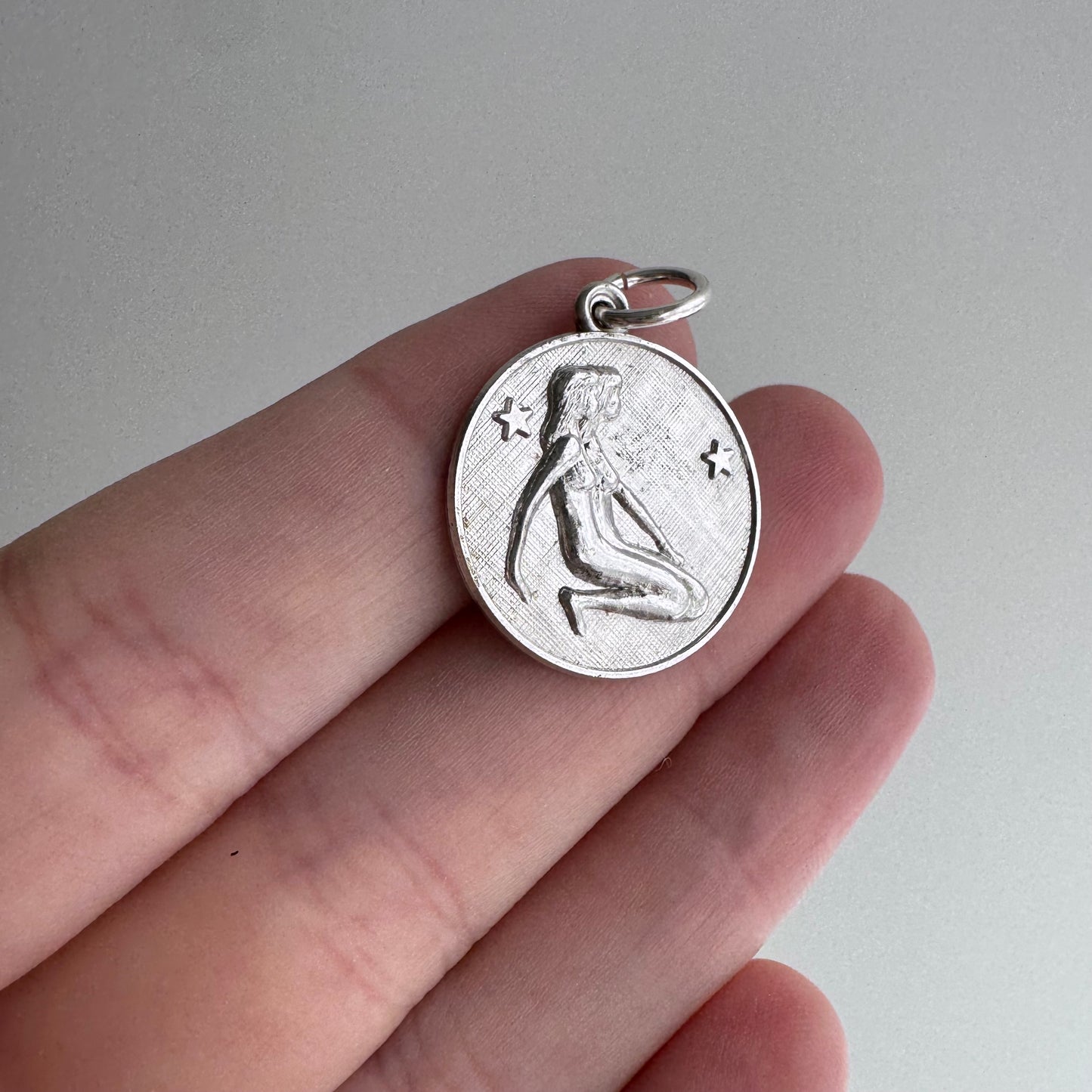 V I N T A G E // side by side / sterling silver kneeling zodiac femmes / a pendant