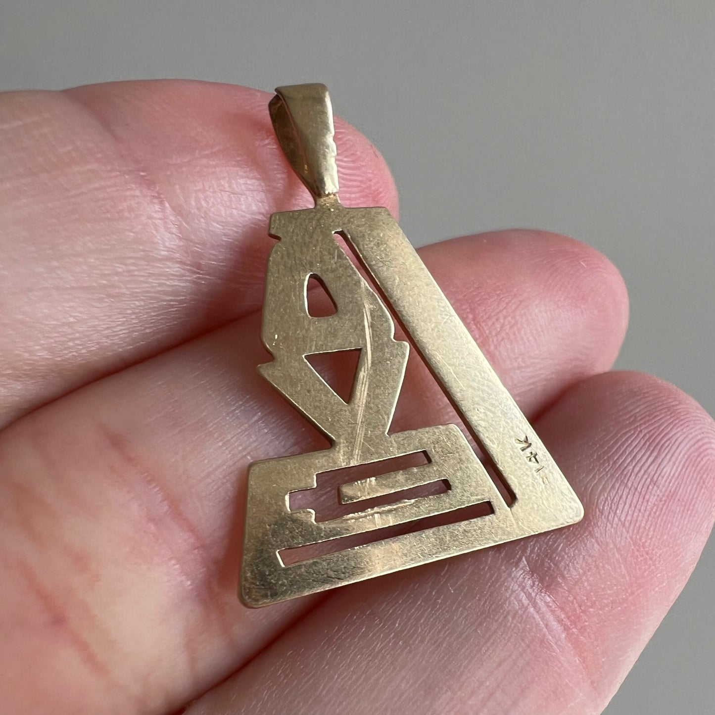 V I N T A G E // 1970s love / 14k yellow gold stylized LOVE / a pendant