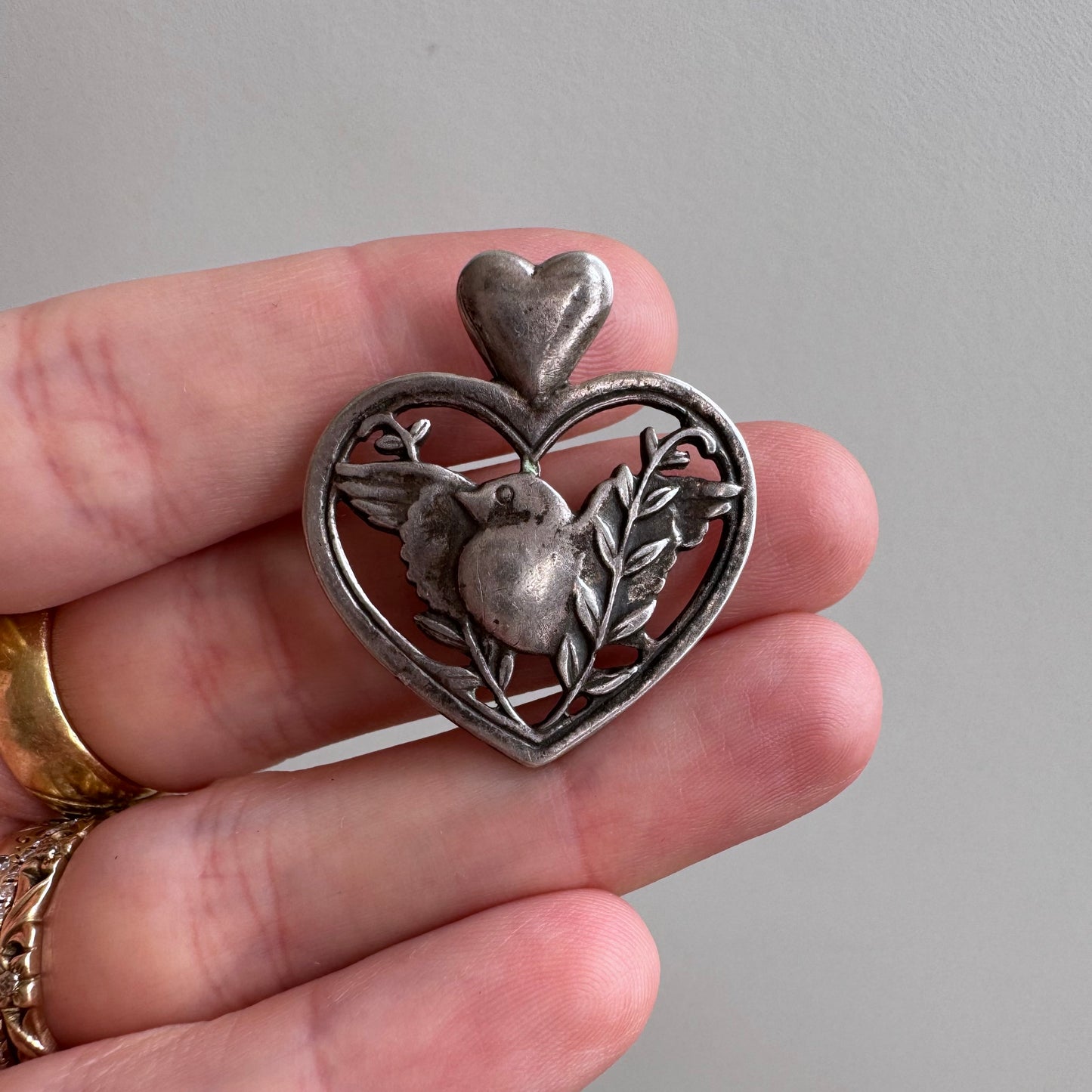 V I N T A G E // sterling silver heart framed love bird pendant