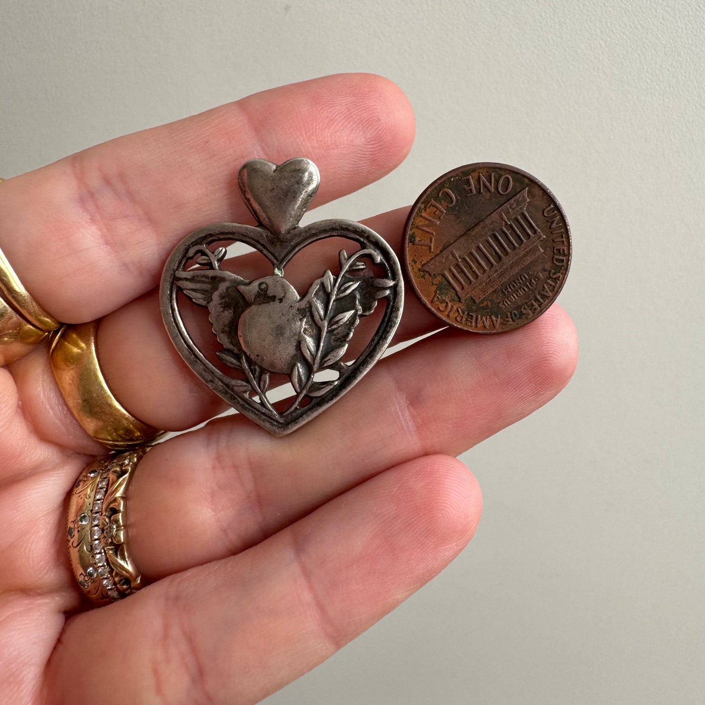 V I N T A G E // sterling silver heart framed love bird pendant