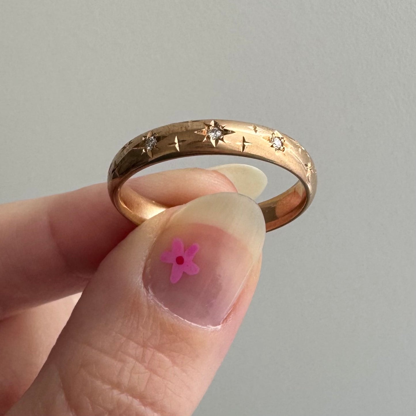 reimagined A N T I Q U E // star story / 14k donut band with three new star-set diamonds and engraved starbursts / size 10