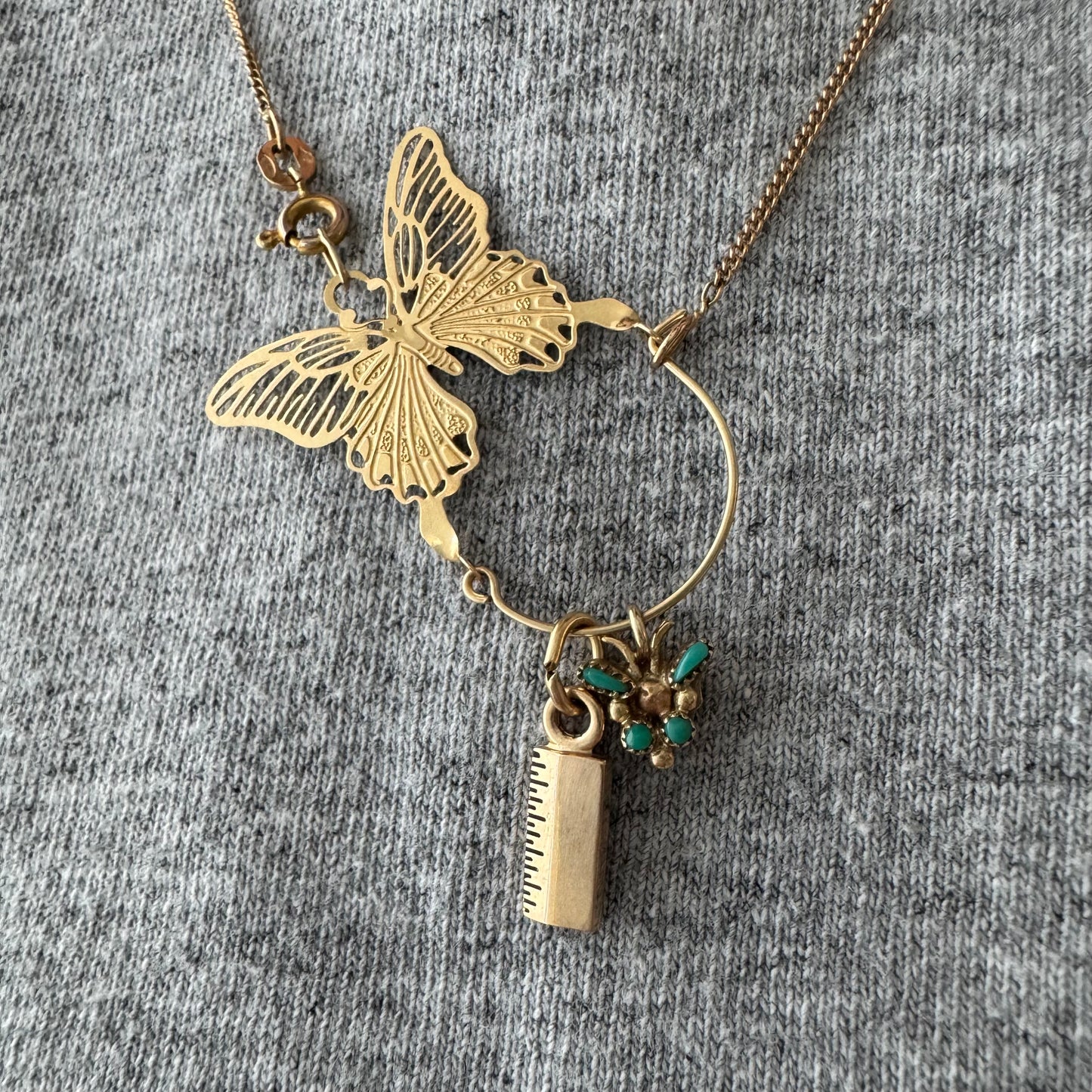 V I N T A G E // metamorphosis / 14k and turquoise teeny tiny butterfly / a pendant